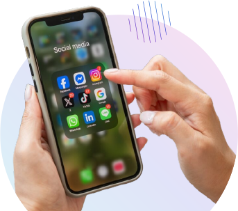 Hand holding phone with social media apps